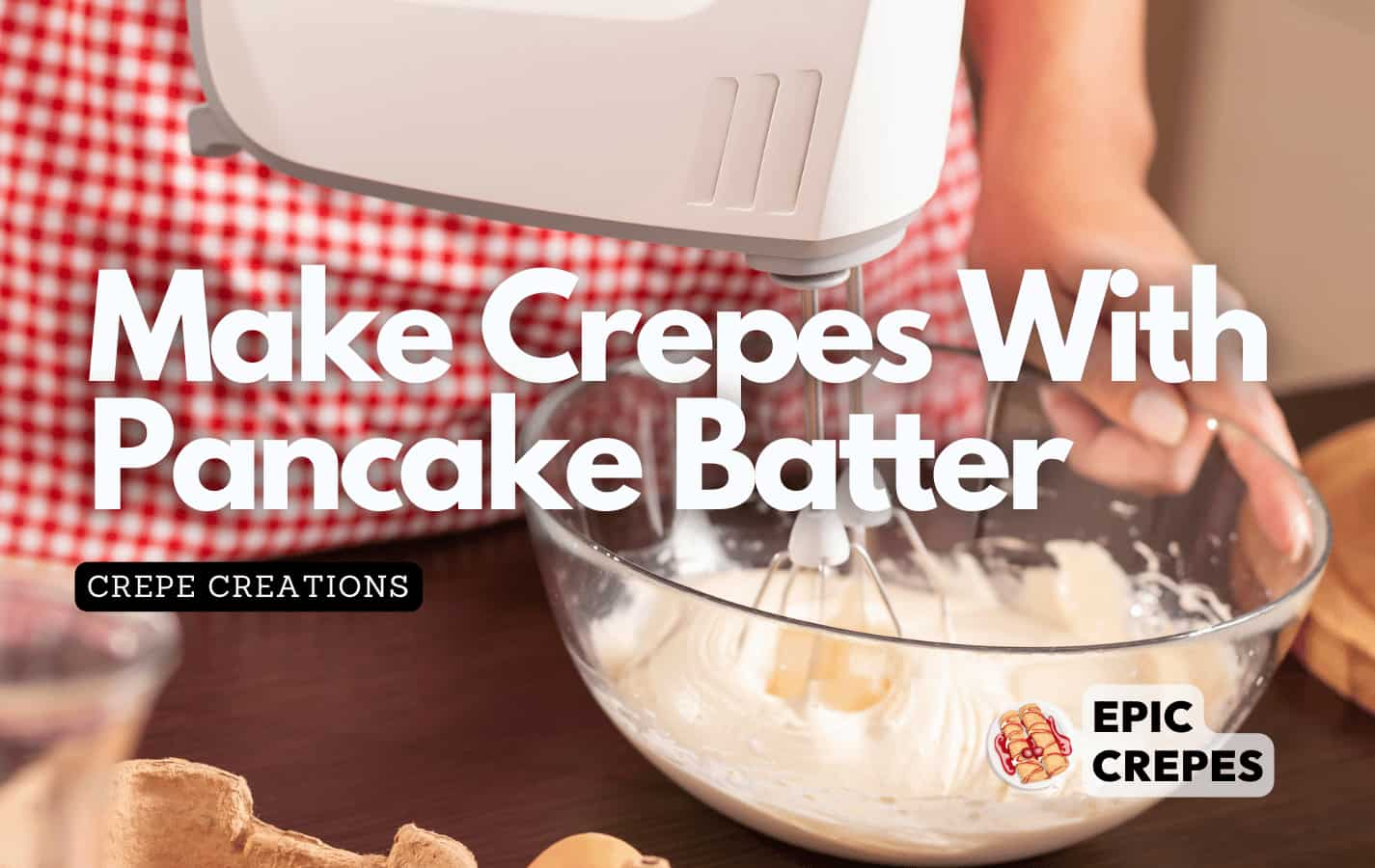 Woman mixing pancake batter with an hand held mixer