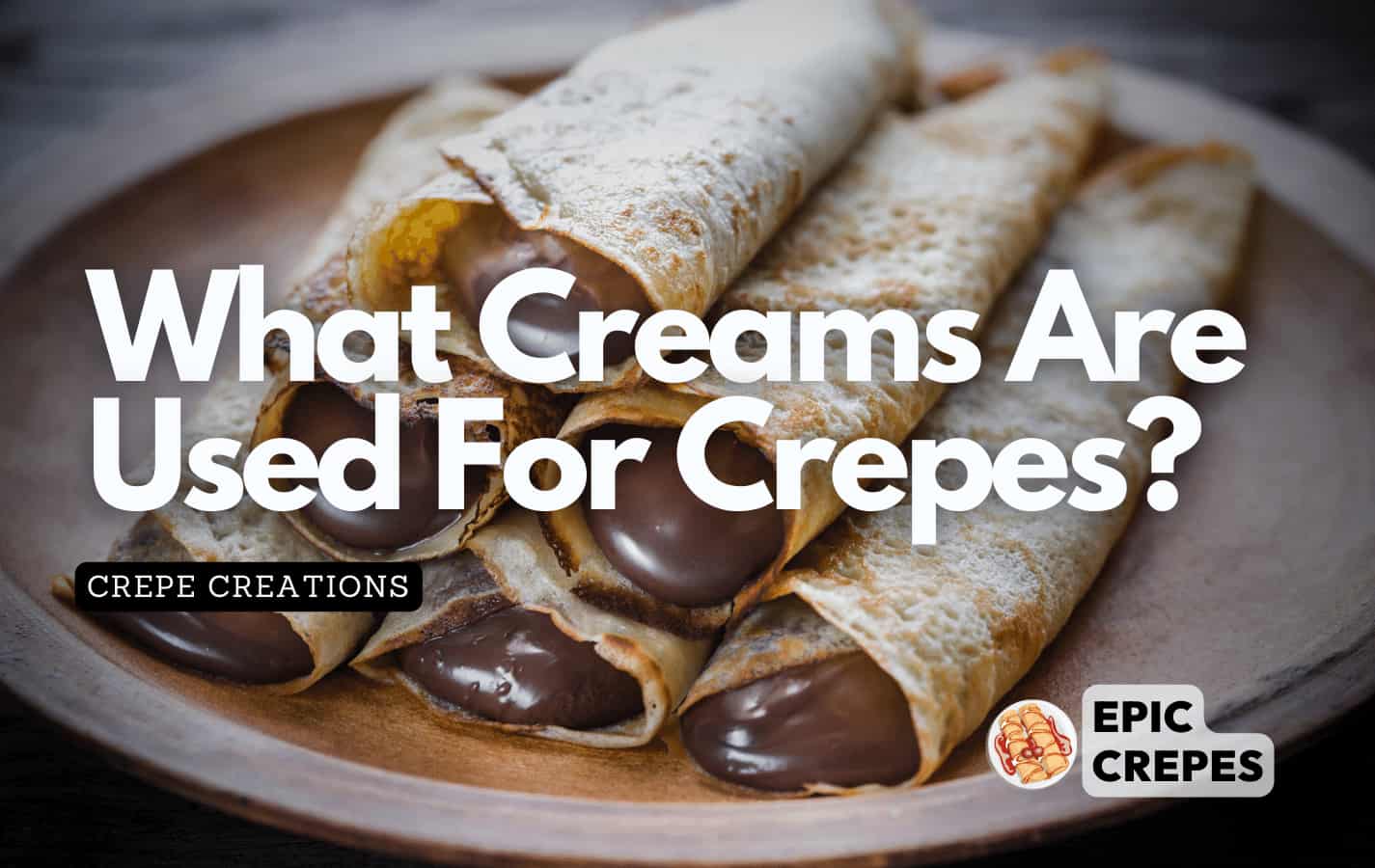 Chocolate filled crepes on a plate ready to be devoured