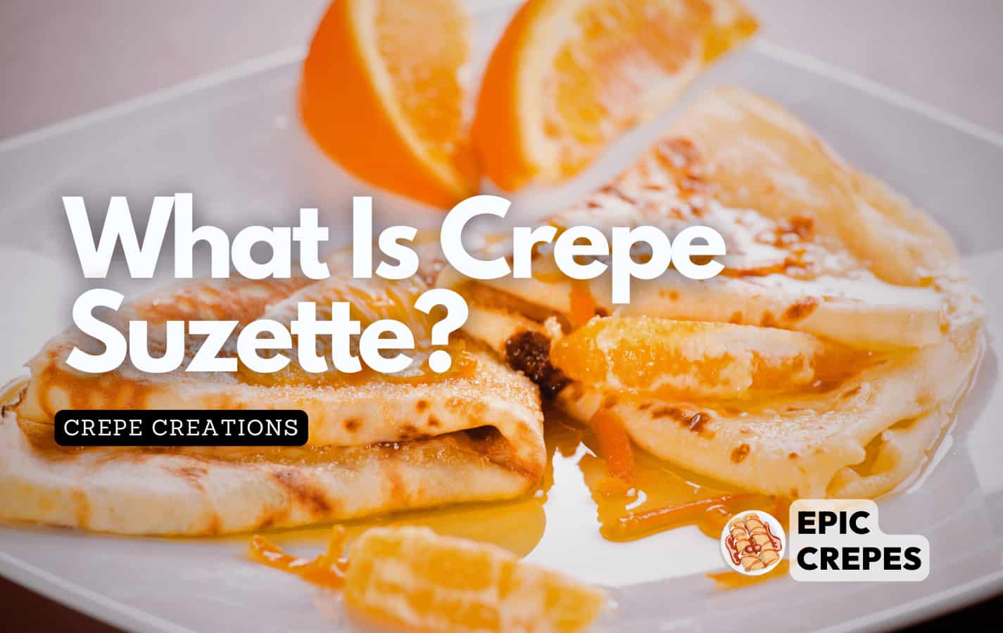 Crepe Suzette on a plate with fresh orange slices as a garnish